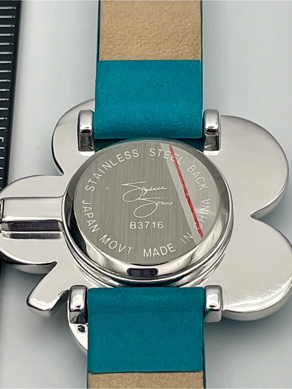 Suzanne Somers Turquoise Flower Watch with Rhinestone Bezel. Blue Leather Band